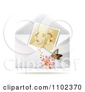 Instant Photo Of Wedding Rings With A Butterfly And Daisy On An Envelope