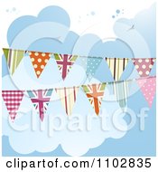 Patterned And Uk Bunting Flags Against A Cloudy Sky