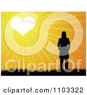 Clipart Silhouetted Woman Basking In Heart Sunshine Royalty Free Vector Illustration