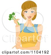 Beautiful Woman Pointing Wearing A Yellow Apron And Holding Celery
