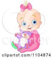 Happy Baby Girl Holding A Teddy Bear And Sitting In Pink Sleeper Pajamas