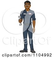 Clipart Happy Black Male Auto Mechanic Holding A Wrench Royalty Free Vector Illustration