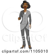 Black Business Woman In A Pant Suit Holding Up Her Knuckles