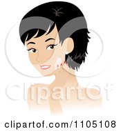 Black Haired Woman Washing Her Face Or Applying Cream
