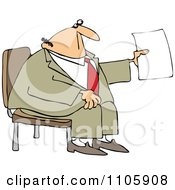 Businessman Sitting And Holding Up A Piece Of Paper