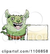 Clipart Pudgy Green Gremlin With A Sign Royalty Free Vector Illustration