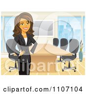 Happy Brunette Businesswoman Standing By A Meeting Table In An Office