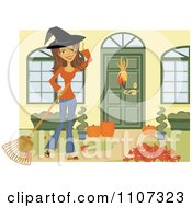 Happy Woman Wearing A Witch Hat And Raking Her Yard For Halloween