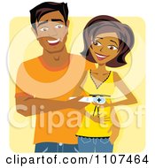 Happy Indian Couple Holding A Positive Pregnancy Test Over Yellow