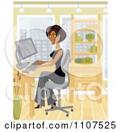 Happy Hispanic Businesswoman Working On Her Computer In Her City Office by Amanda Kate