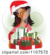 Clipart Happy Indian Woman Carrying Christmas Presents And Wearing A Santa Hat Royalty Free Vector Illustration by Amanda Kate