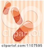 Clipart Pill Capsules Over Orange Stripes Royalty Free Vector Illustration by Amanda Kate
