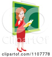 Poster, Art Print Of Happy Female School Teacher Reading A Book By A Chalk Board