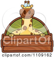 Giraffe With A Wooden Sign