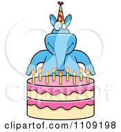Blue Aardvark Making A Wish Over Candles On A Birthday Cake