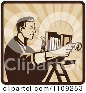 Poster, Art Print Of Retro Male Photographer Shooting With An Antique Bellows Camera On A Square Of Rays