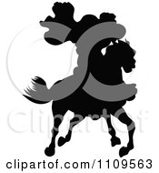 Poster, Art Print Of Silhouetted Caped Rider On A Horse