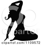 Silhouetted Pinup Woman Sitting On Her Knees