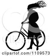 Poster, Art Print Of Silhouetted Woman Standing With A Bicycle