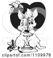 Clipart Black And White Aussie Kangaroo Couple Embracing Over A Heart Royalty Free Vector Illustration
