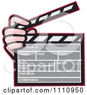 Hand Holding A Movie Clapper Board