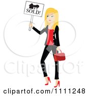 Blond Real Estate Agent Holding A Sold Sign