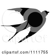 Clipart Silhouetted Swallow In Black And White Royalty Free Vector Illustration