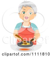 Poster, Art Print Of Happy Female Senior Citizen Cooking Eggs