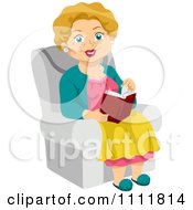 Poster, Art Print Of Happy Female Senior Citizen Reading In A Chair