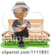 Happy Black Male Senior Citizen Reading On A Park Bench