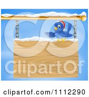 Poster, Art Print Of Christmas Bluebird Perched In Snow And Presenting A Hanging Wood Sign Against A Sky