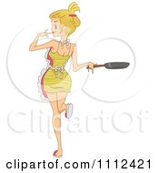 Sexy Cooking Blond Woman Holding A Frying Pan And Looking Back