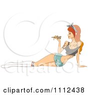Red Haired Female Tattoo Artist Holding Needle Machine