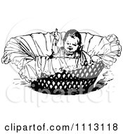 Clipart Vintage Black And White Baby In A Basket Royalty Free Vector Illustration