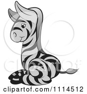 Clipart Cute Black And Gray Baby Zebra Resting Royalty Free Vector Illustration