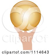 Hand Holding A Shiny Golden Sphere