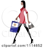 Slender Hispanic Pregnant Woman Walking With A Shopping Bag And Purse