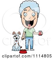 Happy Senior Woman Feeding Her Dog