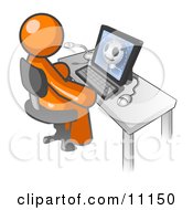 Orange Doctor Man Sitting At A Computer And Viewing An Xray Of A Head