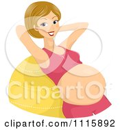 Fit Pregnant Woman Doing Crunches On An Exercise Ball