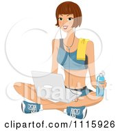 Fit Woman In Exercise Clothes Using A Laptop On The Floor