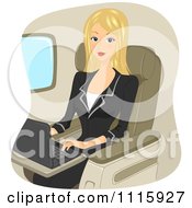 Poster, Art Print Of Traveling Blond Businseswoman Using A Laptop On A Plane