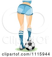 Rear View Of The Legs Of A Sexy Woman Resting Her Foot On A Soccer Ball