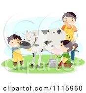 Happy Kids Milking A Cow