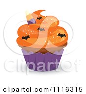 Halloween Cupcake With Orange Frosting A Purple Wrapper And Bat Sprinkles
