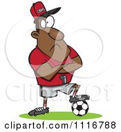 Black Coach Man Resting A Foot On A Soccer Ball