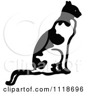 Clipart Of A Retro Vintage Black And White Cat Sitting In Profile Royalty Free Vector Illustration