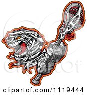 Clipart Of A Halloween Mummy Lacrosse Ball Mascot Holding A Stick Royalty Free Vector Illustration by Chromaco