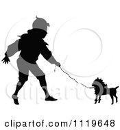 Clipart Of A Black And White Silhouetted Boy Walking A Dog Royalty Free Vector Illustration