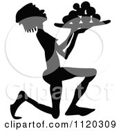Clipart Of A Silhouetted Servant Kneeling With A Tray Of Food Royalty Free Vector Illustration